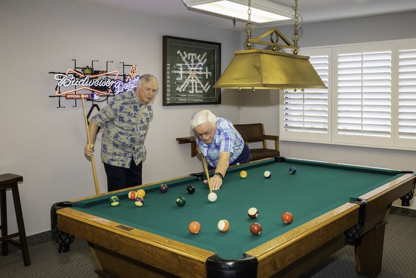 Two men playing a game of pool